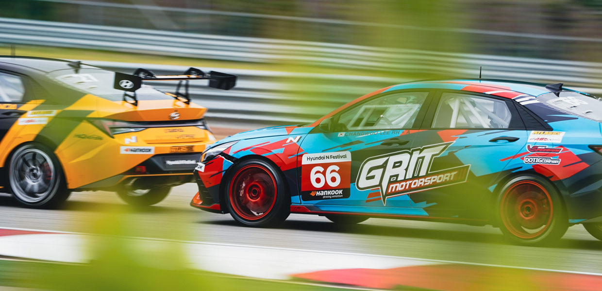 Race cars participating in the N Festival show fierce driving