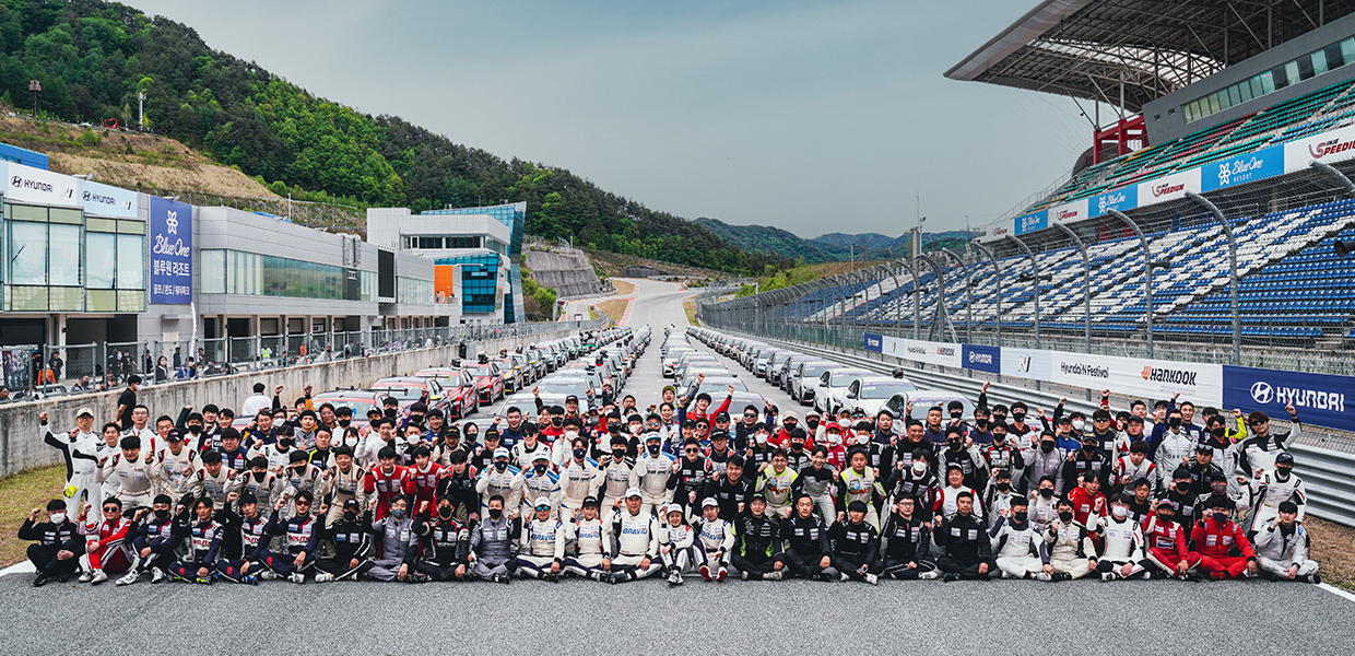 N Festival participants posing on the race track