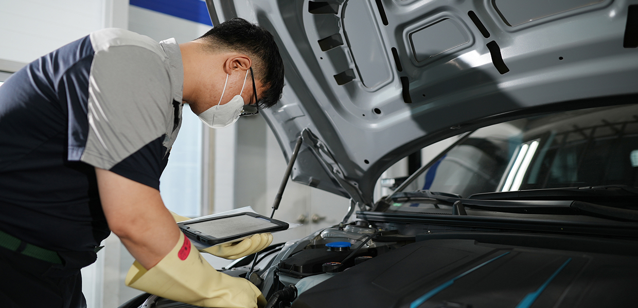 The technician is checking an electric vehicle