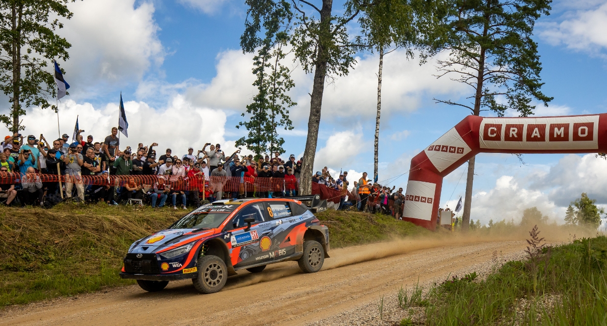 Hyundai Rally Team's i20 rally car is driving down a rough road