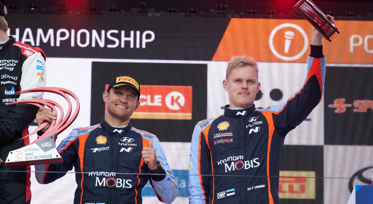 Ott Tanak and Martin Järveoja pose on the podium