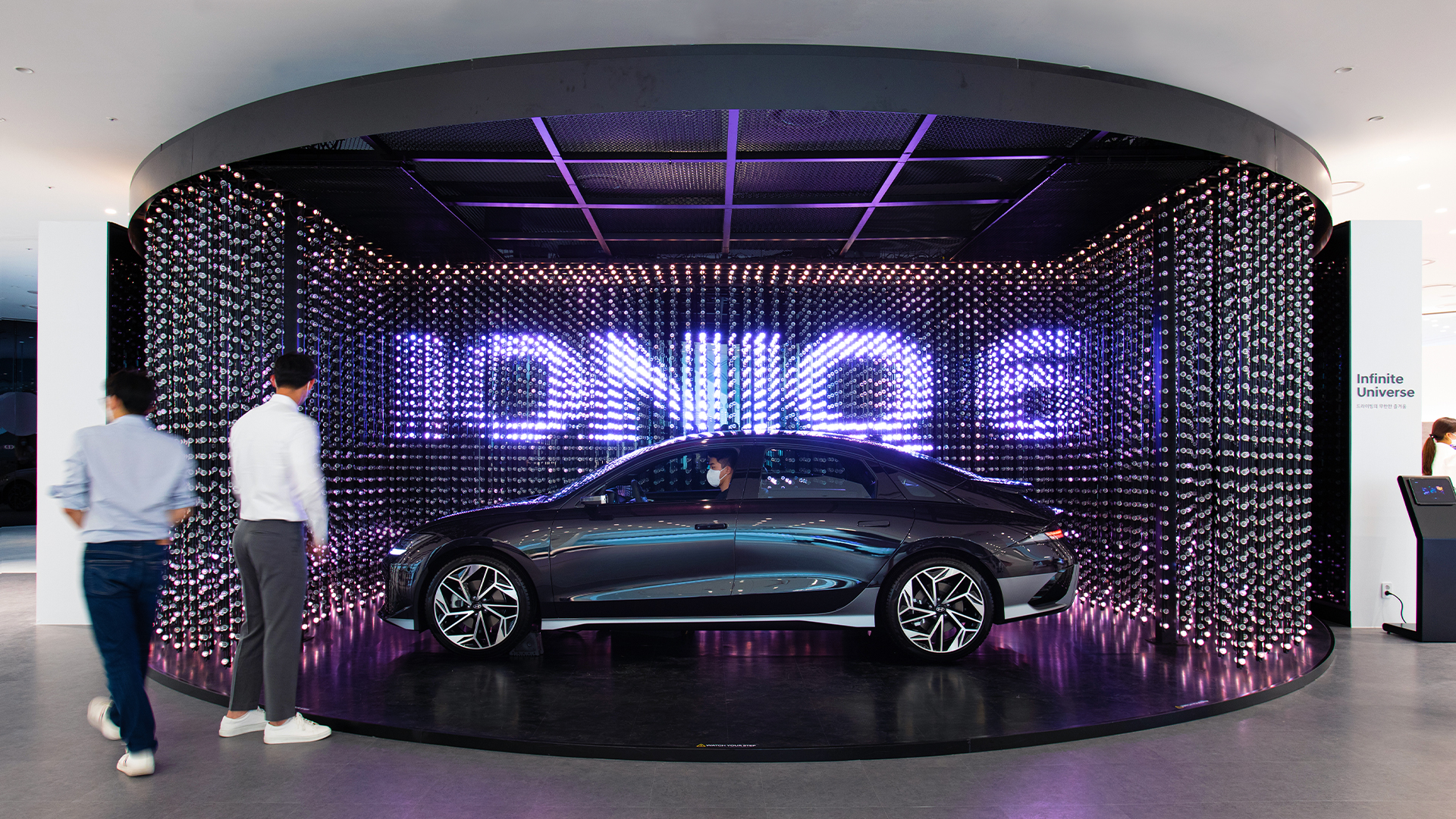 The IONIQ 6 is displayed with a crystal LED in the background