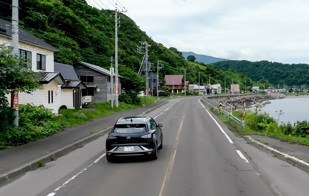 Hyundai Nexo in motion on a country road along the sea