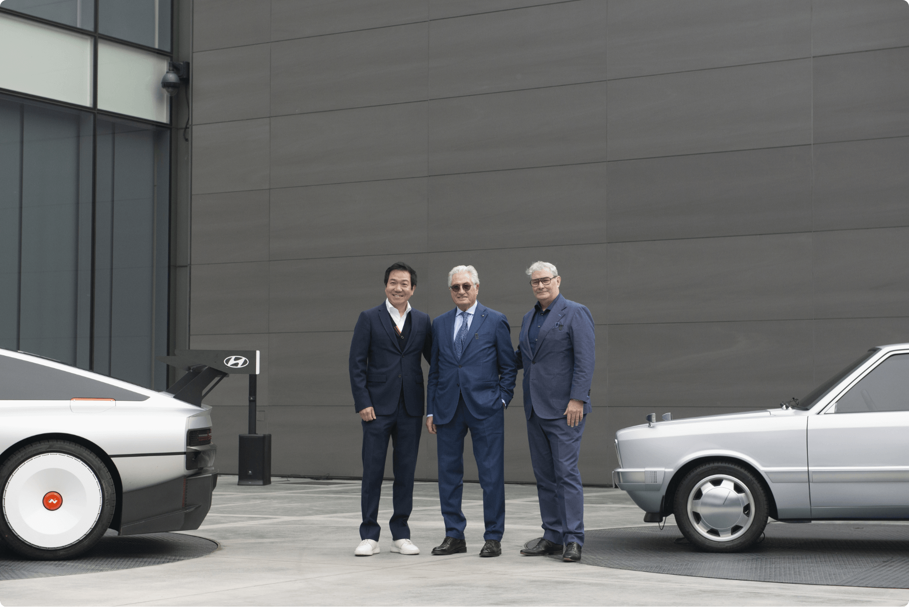 Giorgetto Giugiaro, Luc Donckerwolke, Chief Creative Officer of Hyundai Motor Group, and Sang-yup Lee, Executive Vice President and Head of Hyundai Motor's Global Design Center, standing together at the Hyundai Design Center