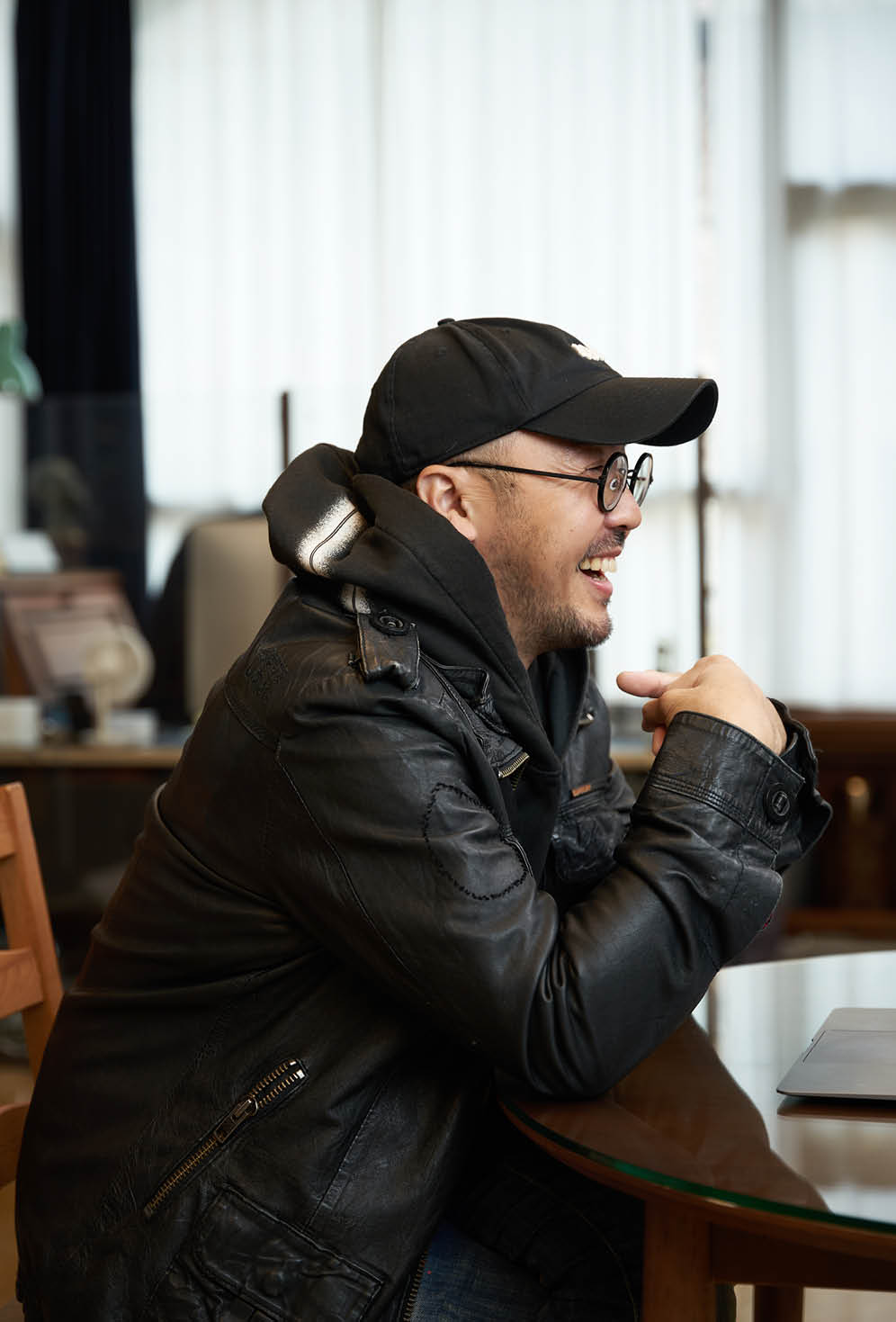 Producer Seo Seung-han smiling as if enjoying the interview