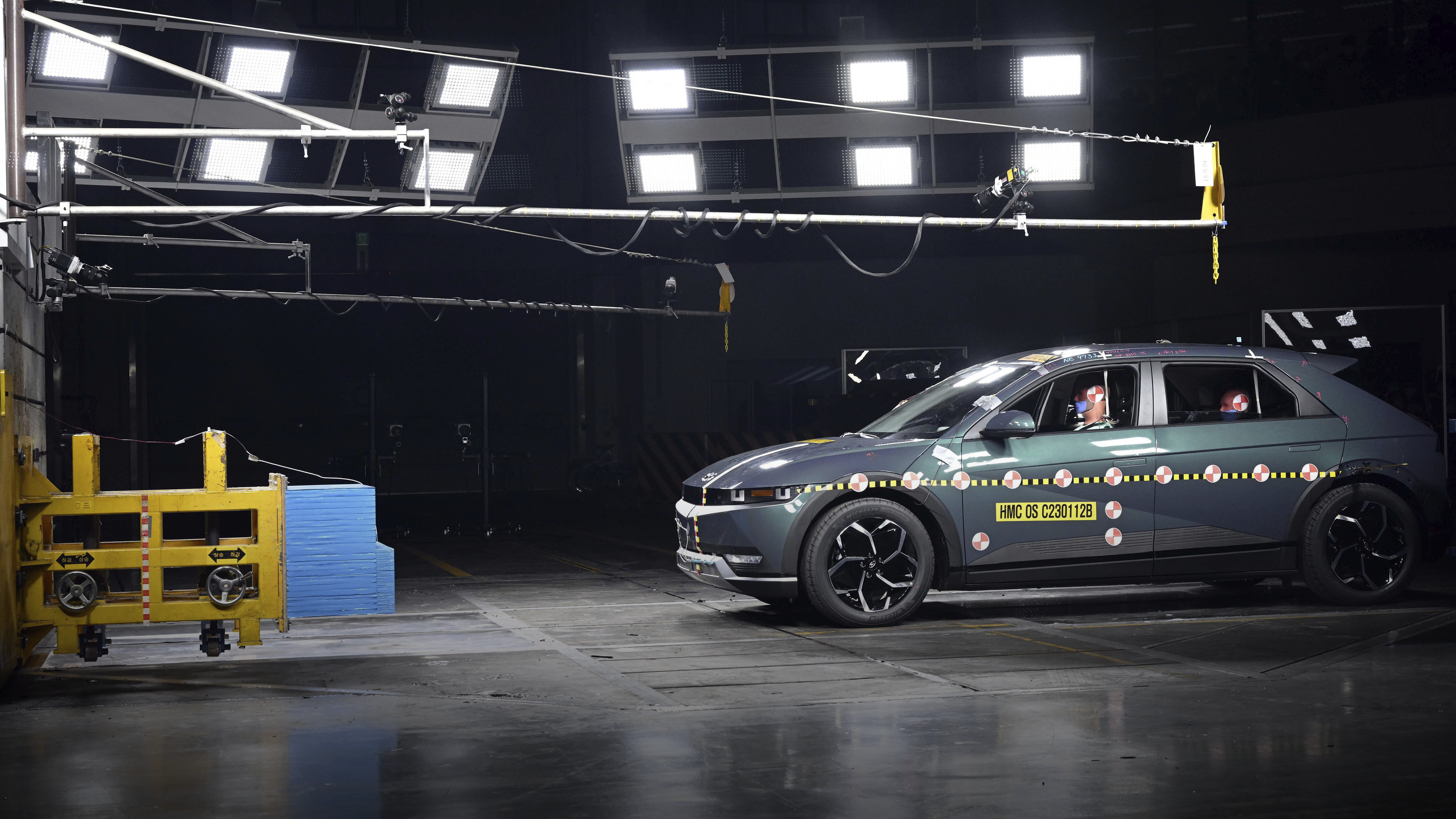 A crash safety assessment test vehicle is rushing towards a structure