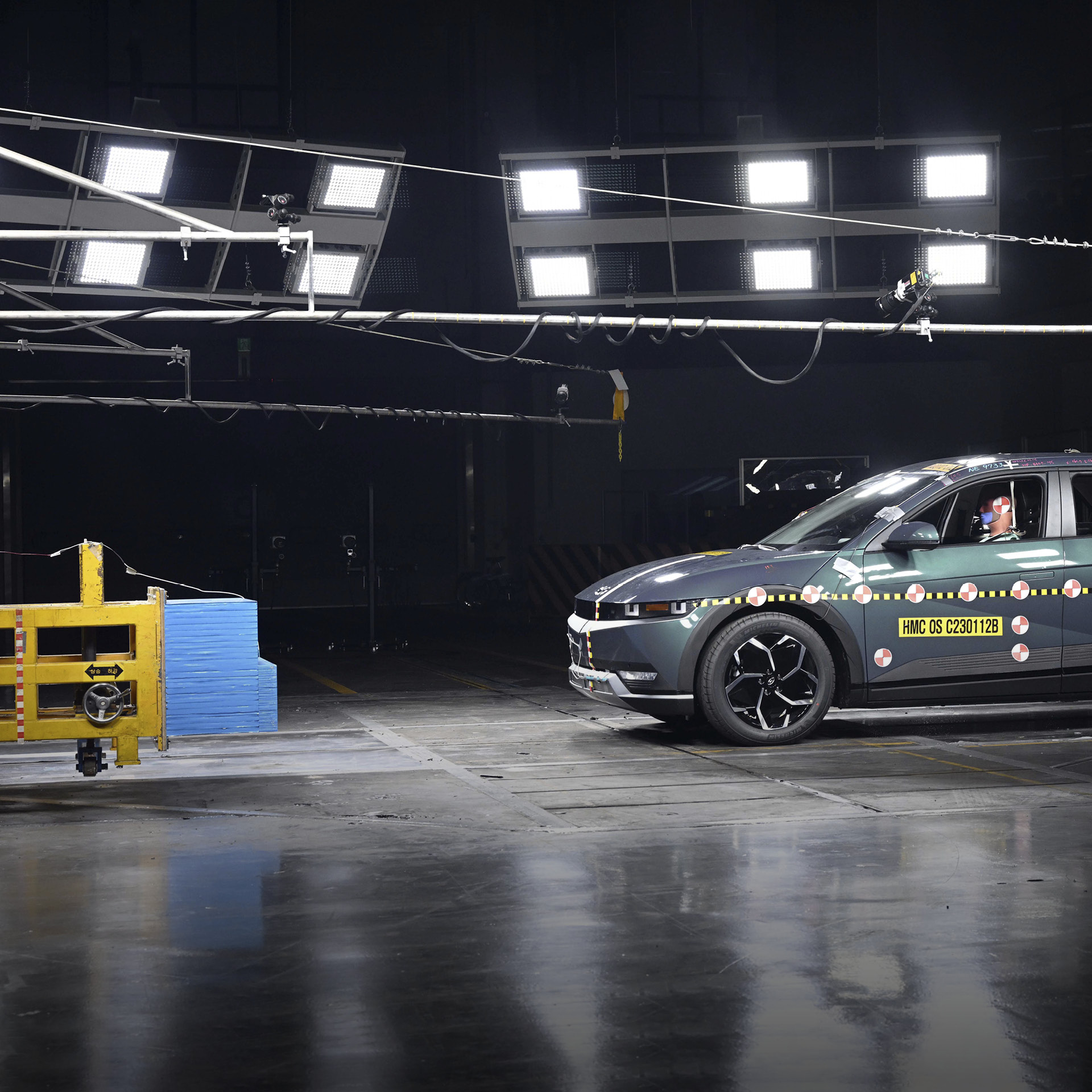 A crash safety assessment test vehicle is rushing towards a structure
