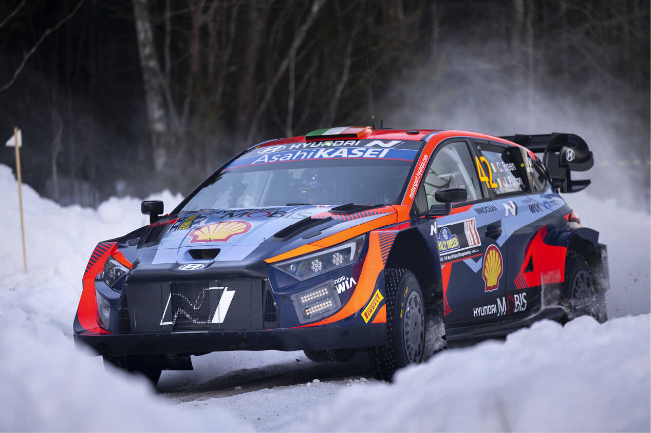 Craig Breen's rally car driving through the snow