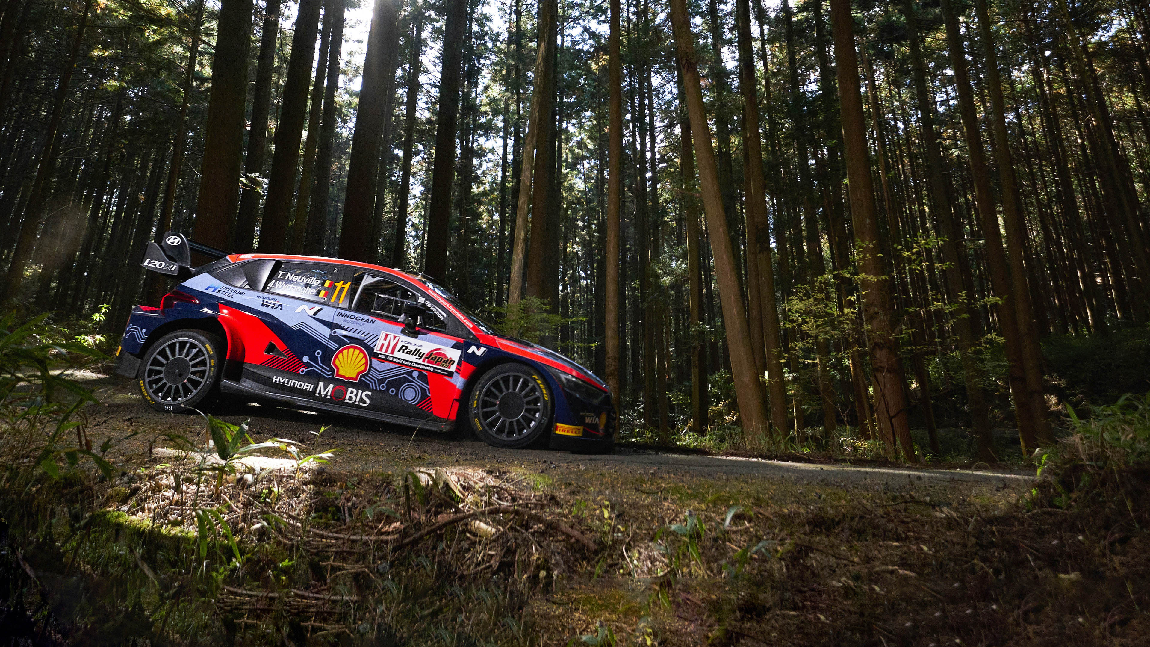 Hyundai WRC rally car getting ready to run on a forest road