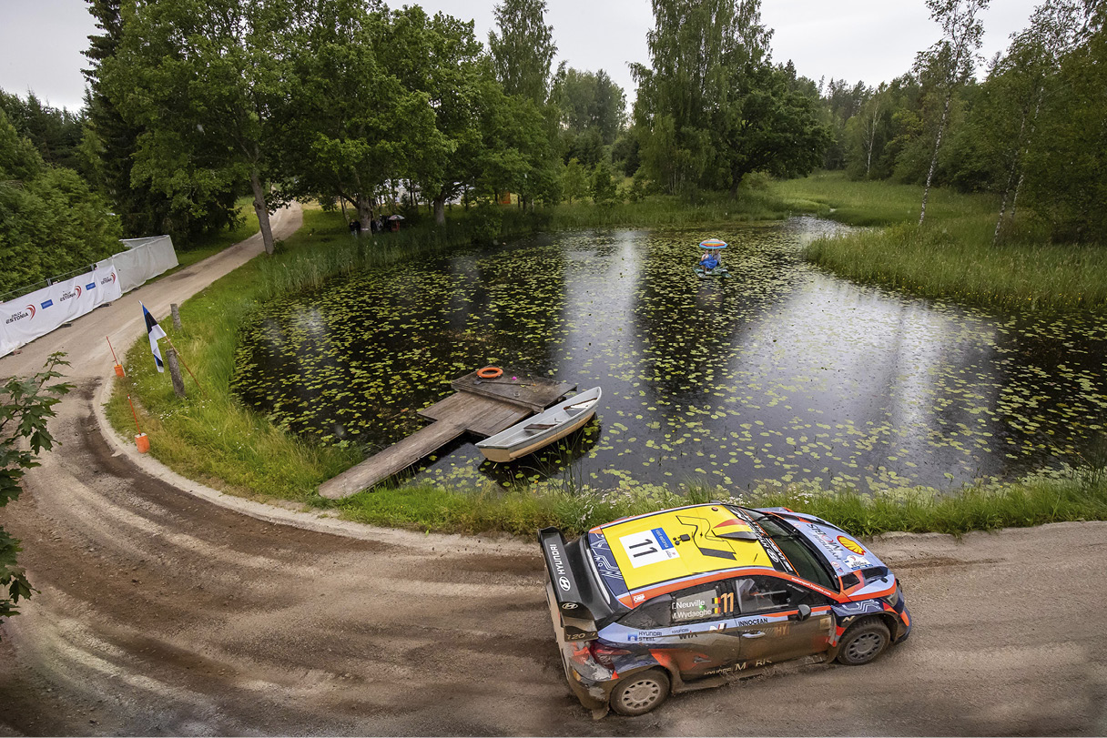 A WRC race car going around the hairpin course