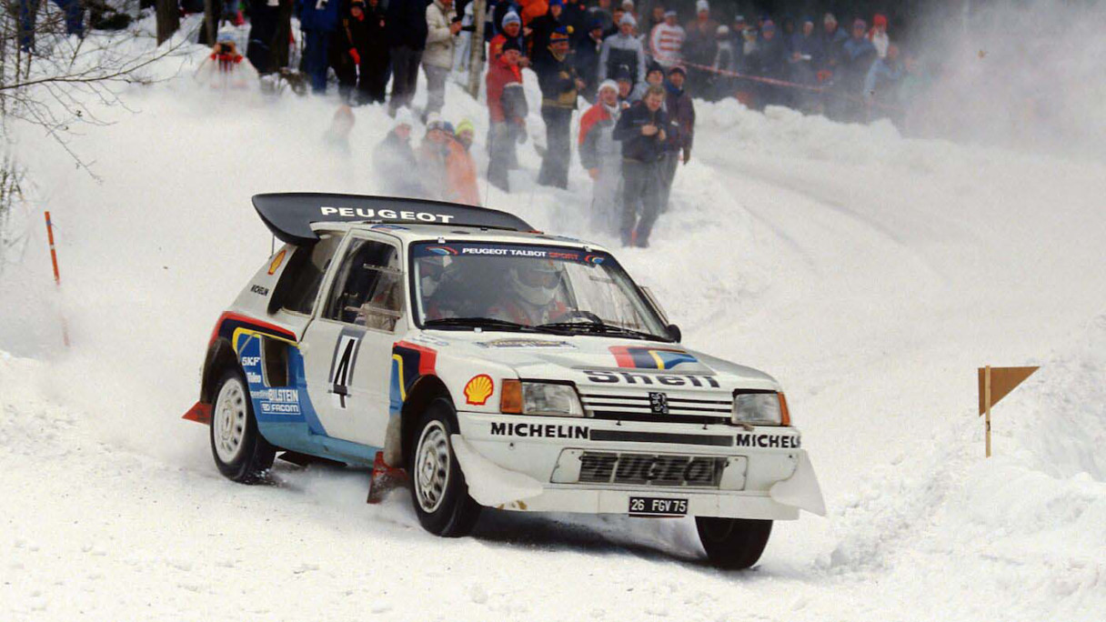 Peugeot racing car gliding on a snowy road