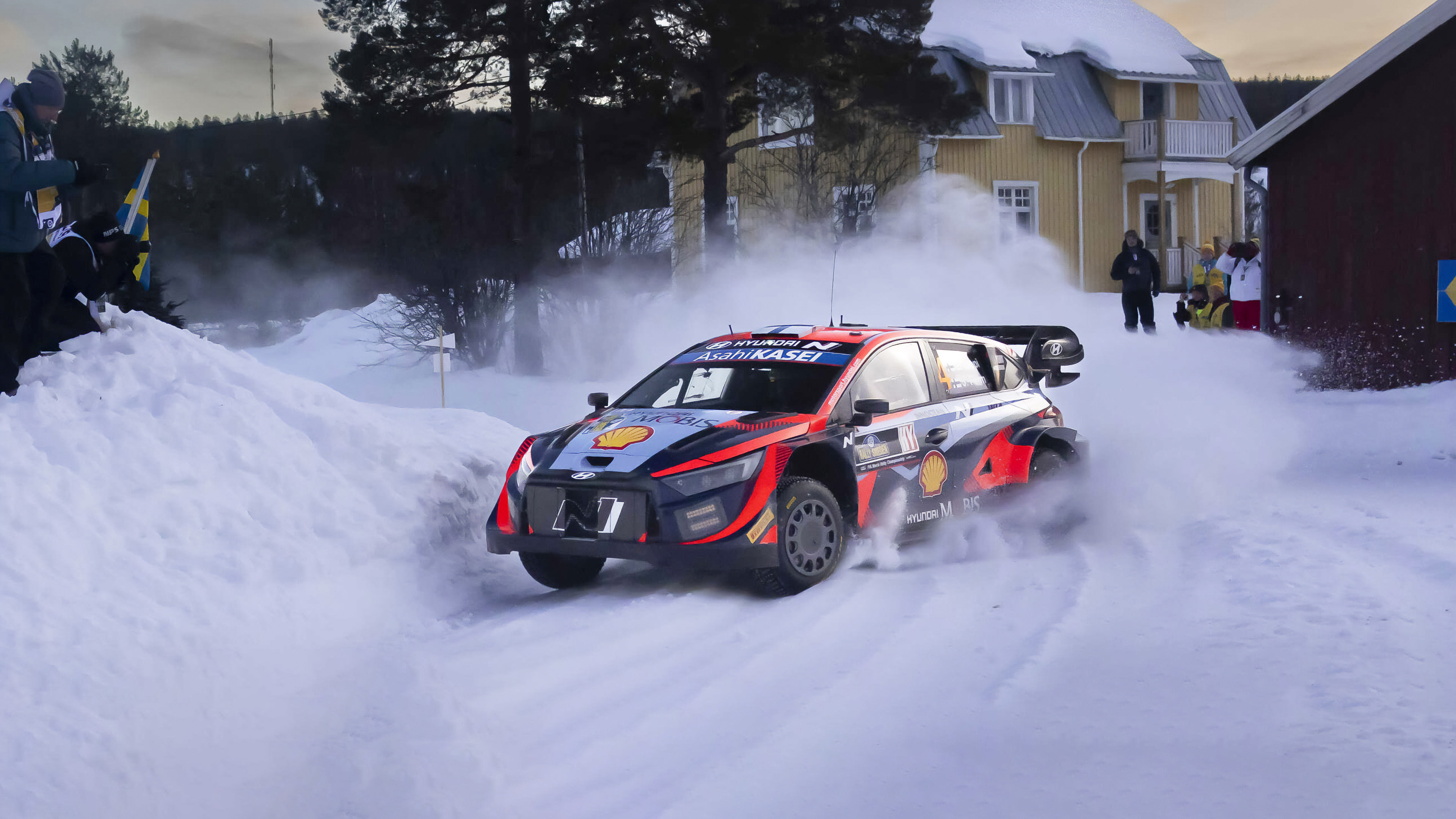 A Hyundai rally car driving on snow