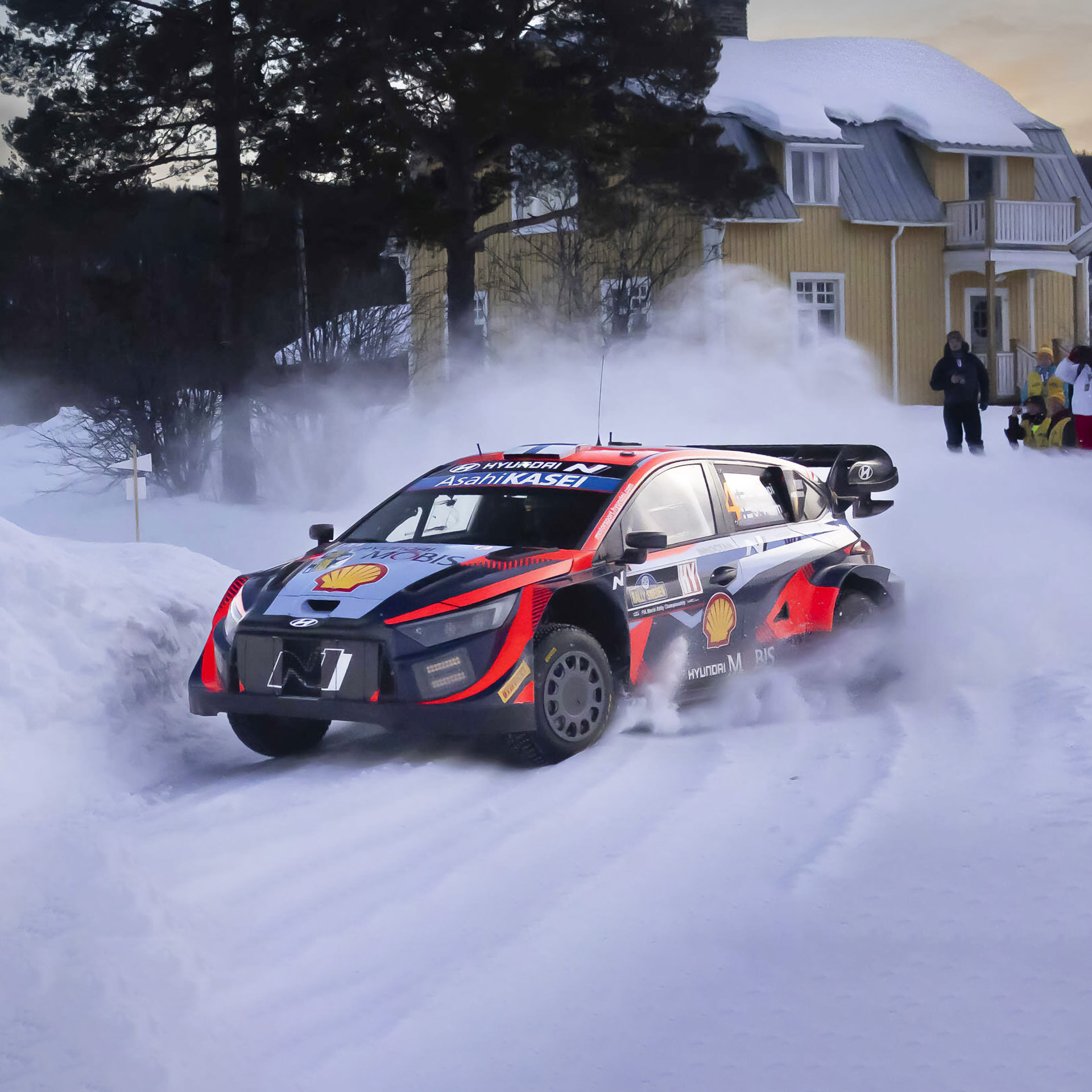 A Hyundai rally car driving on snow