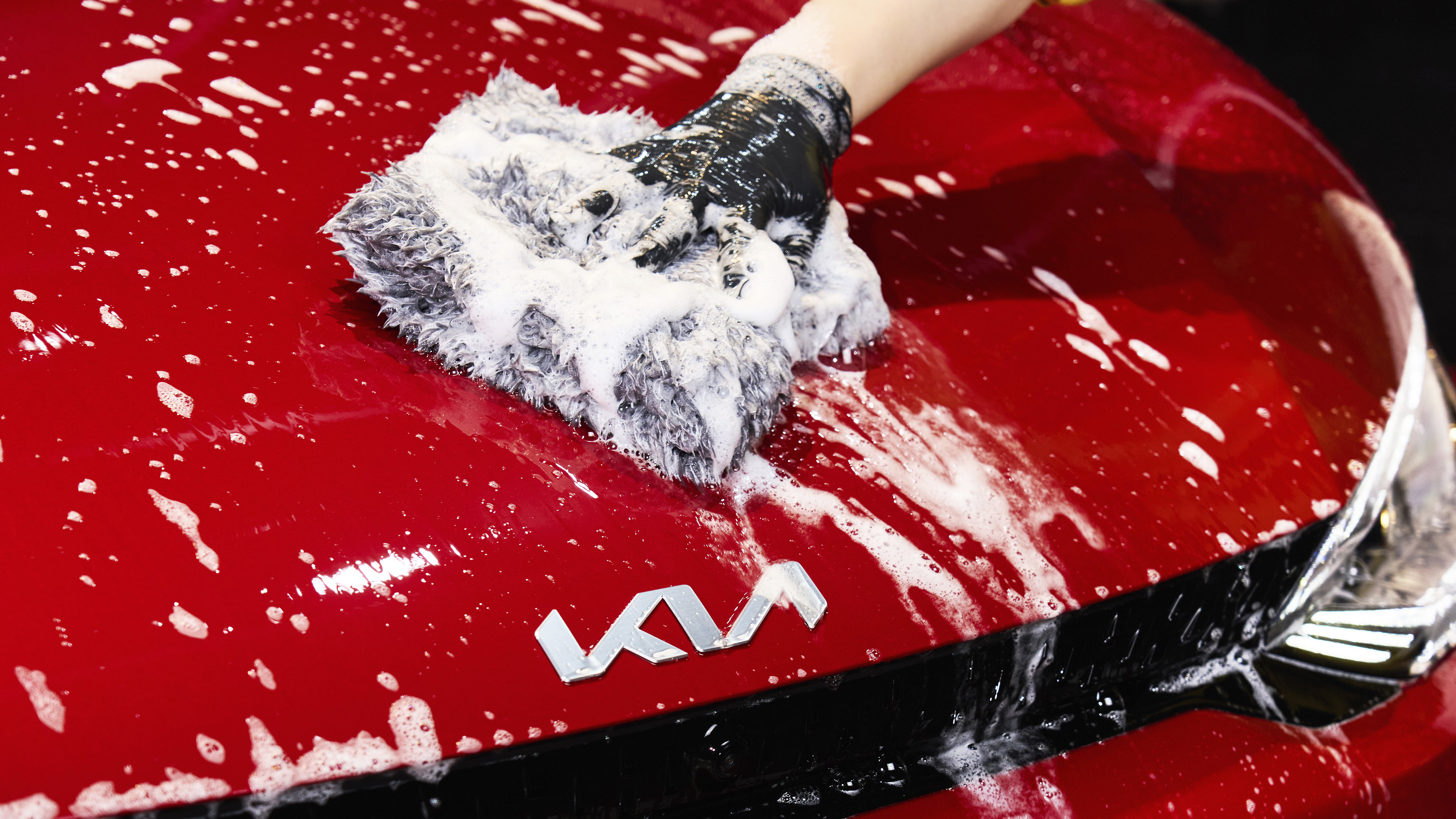 Wiping the EV6 GT bonnet with a wash mitt