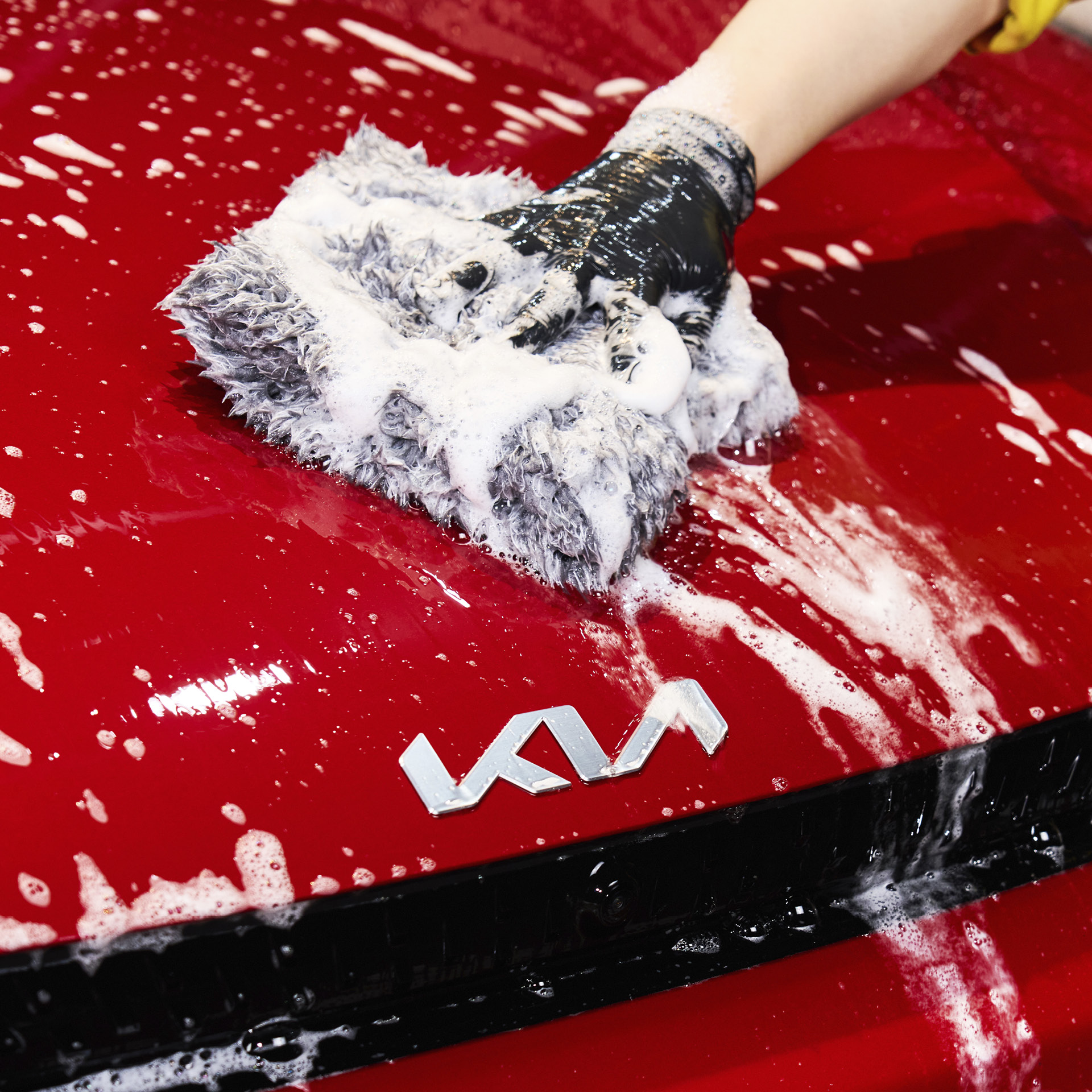 Wiping the EV6 GT bonnet with a wash mitt