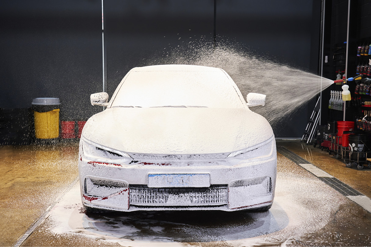 Snow foam being sprayed on the Kia EV6 GT