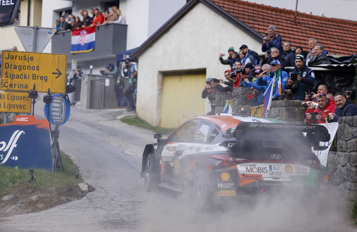 Rally car going around a corner