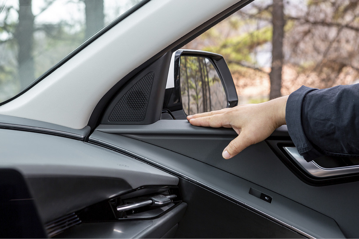 Man's hand touching door trim