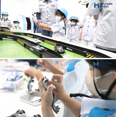 트랙을 따라 미니카가 달리고 있다.쓰임을 다한 클레이 차체를 떼내고 있는 아이.