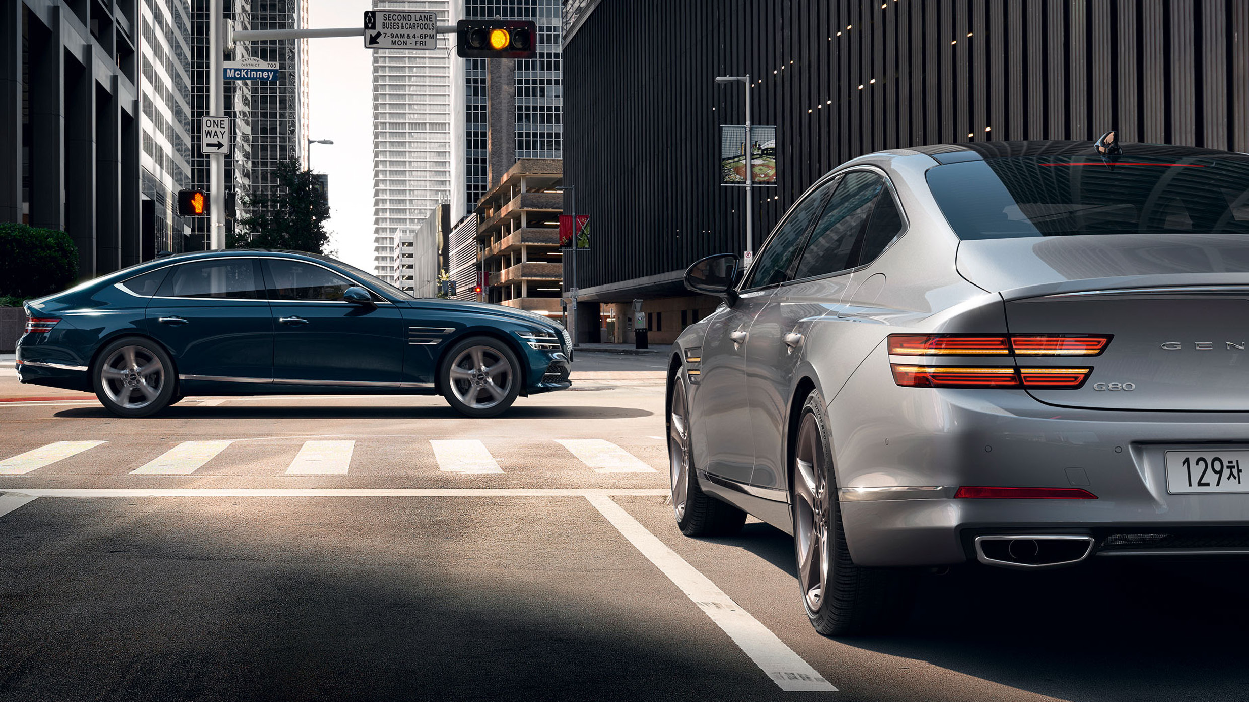 Two G80s standing at an cross road