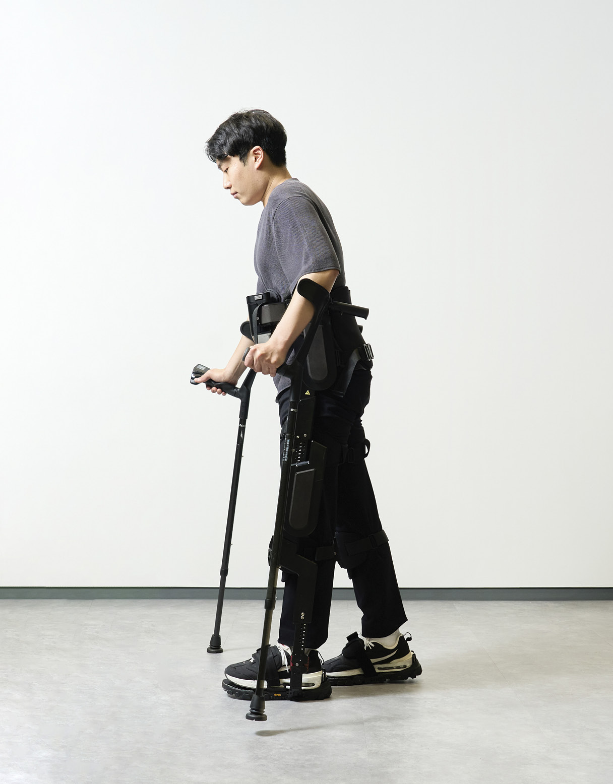 A person walking, wearing The Hyundai Motor Robotics Lab X-ble MEX