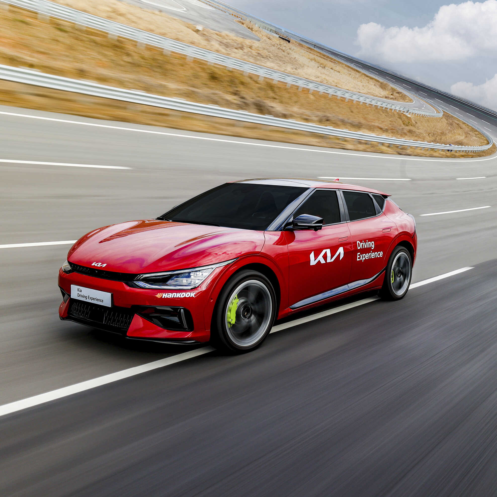 Kia EV6 GT running fast on a high-speed circuit