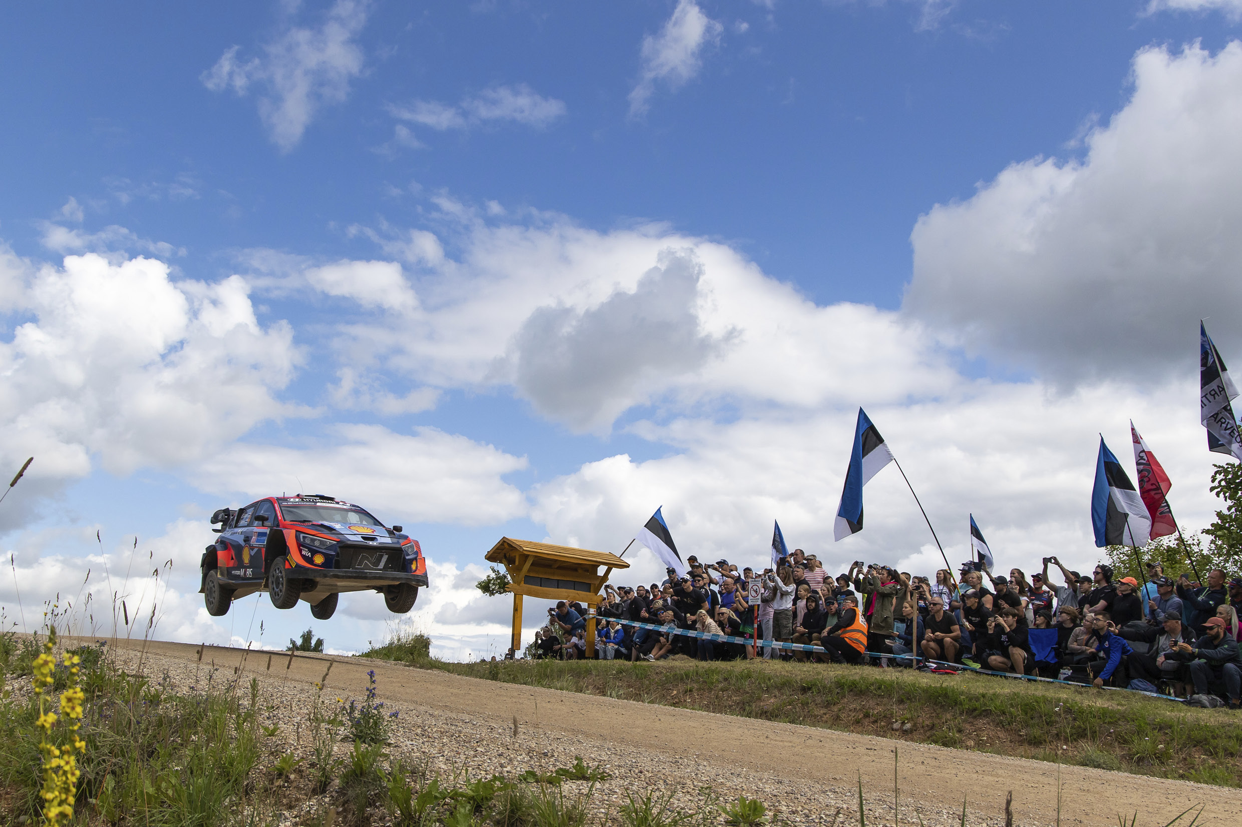 A rally car jumping