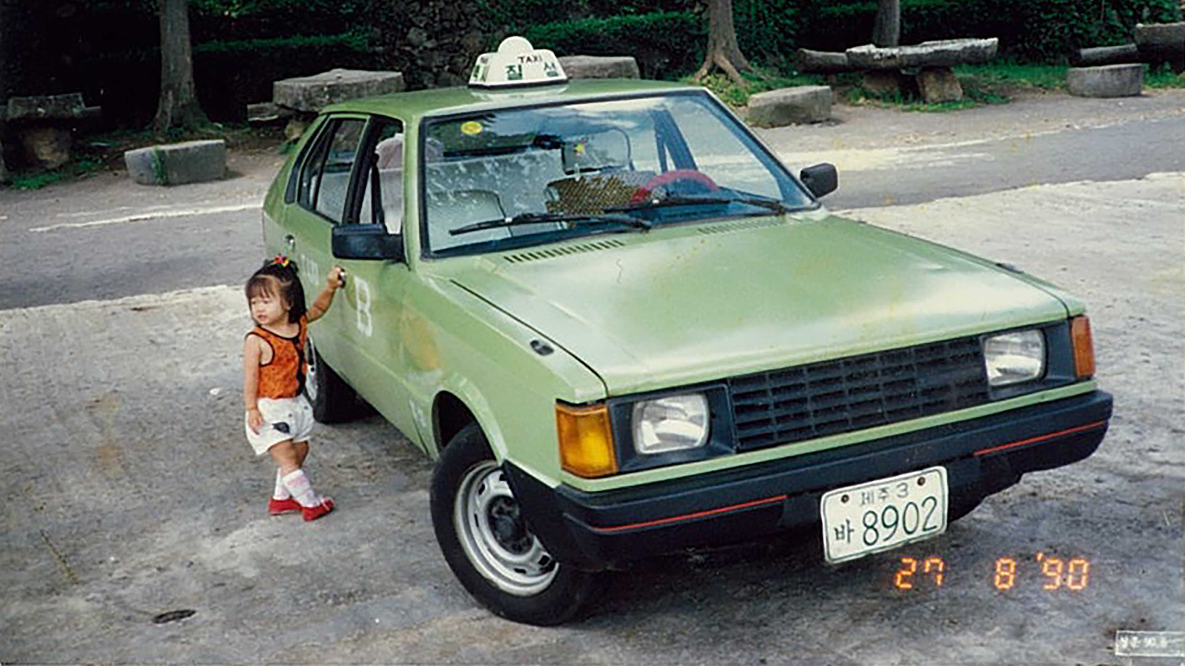 Pony taxi and a child standing next to it