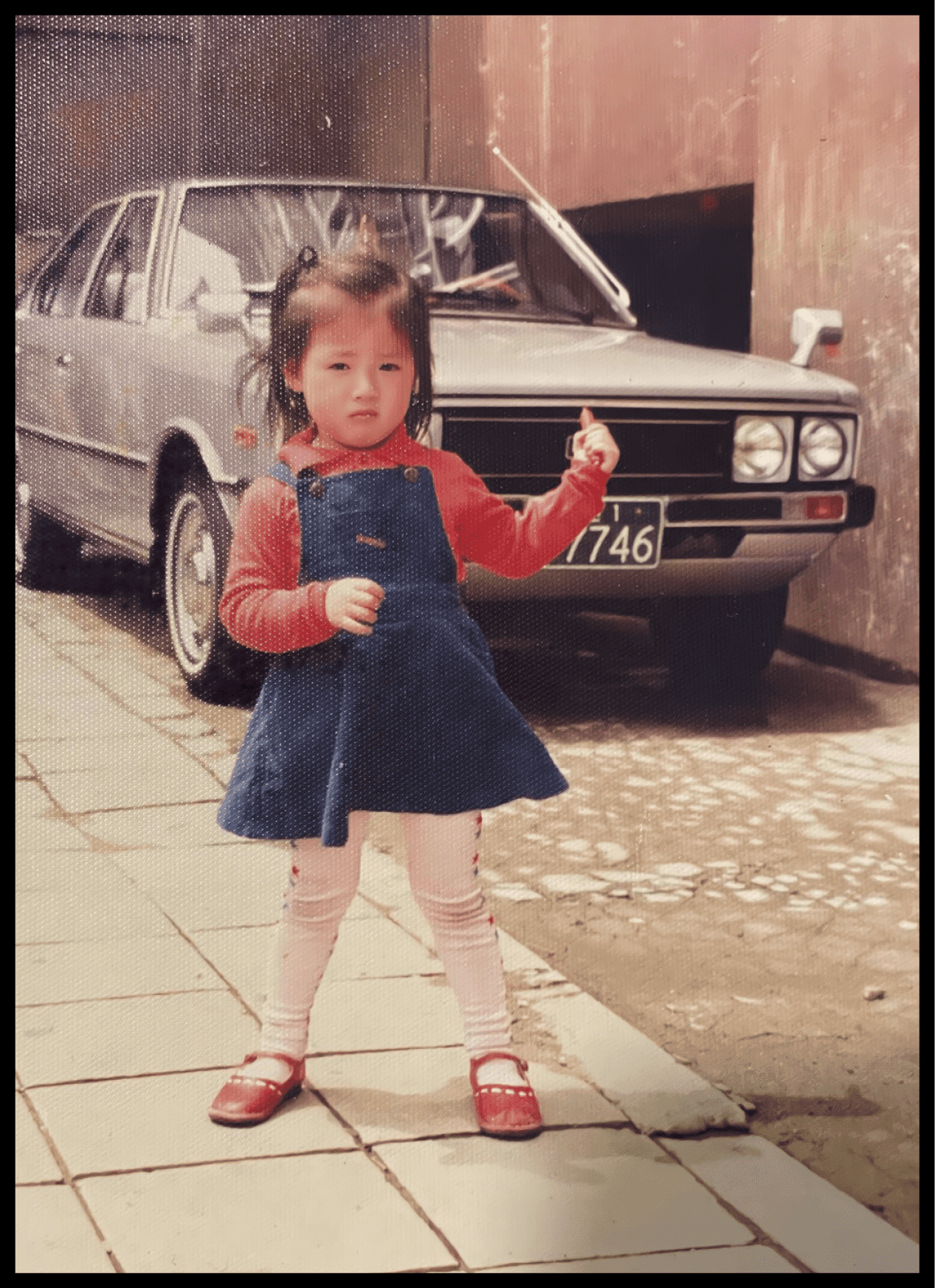 A girl standing in front of Pony