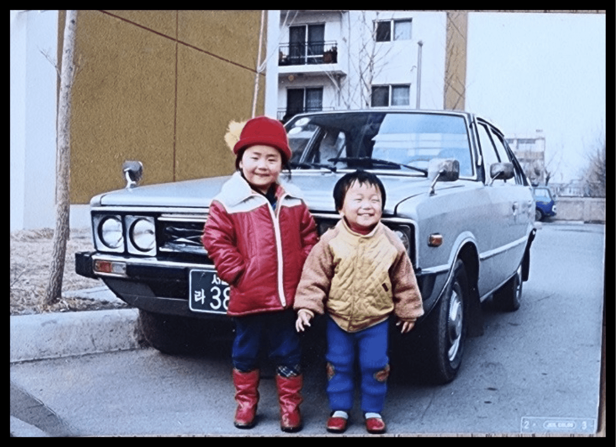 Two children standing in front of Pony