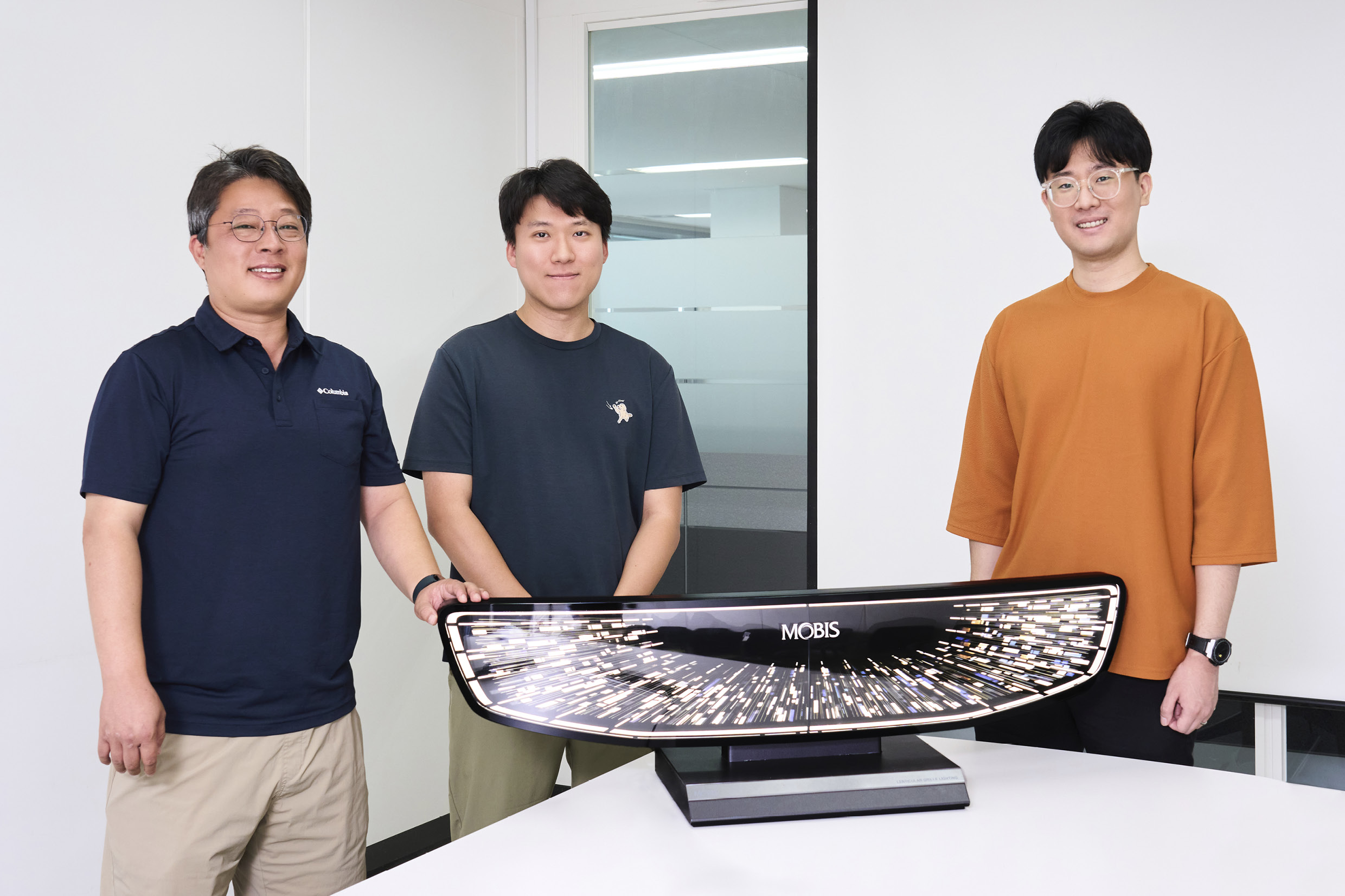 The three researchers who developed the lenticular grille lighting