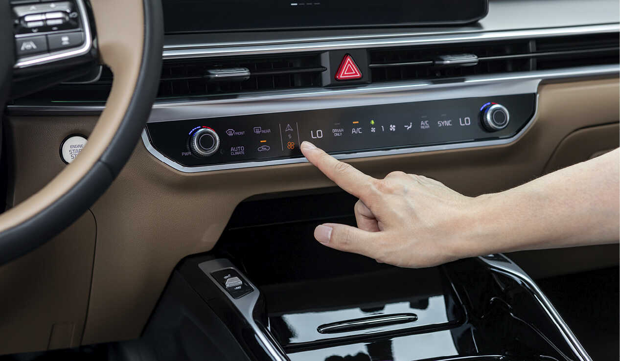 Male hands operating an air conditioner