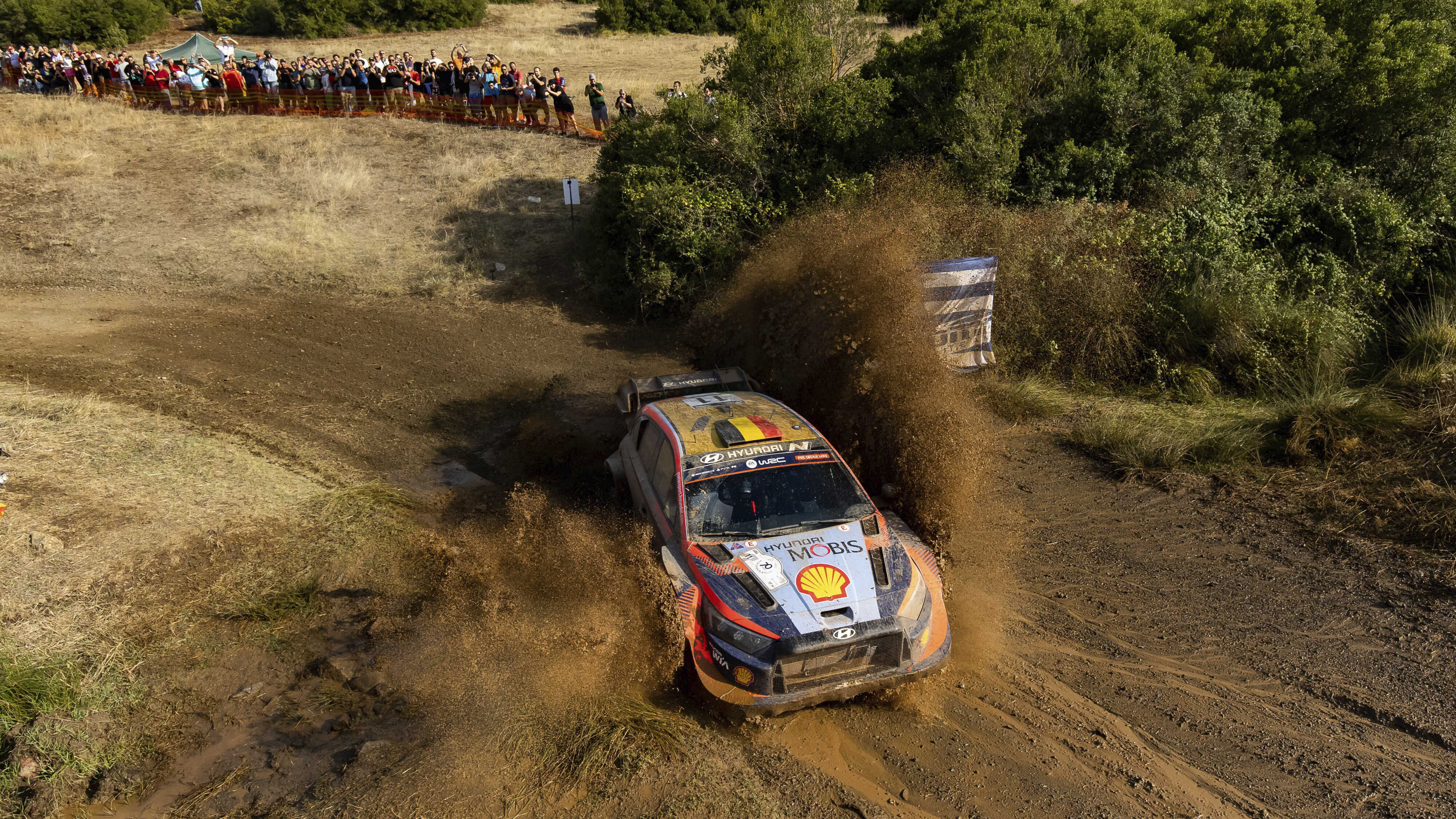 Hyundai rally car in motion on a rough road