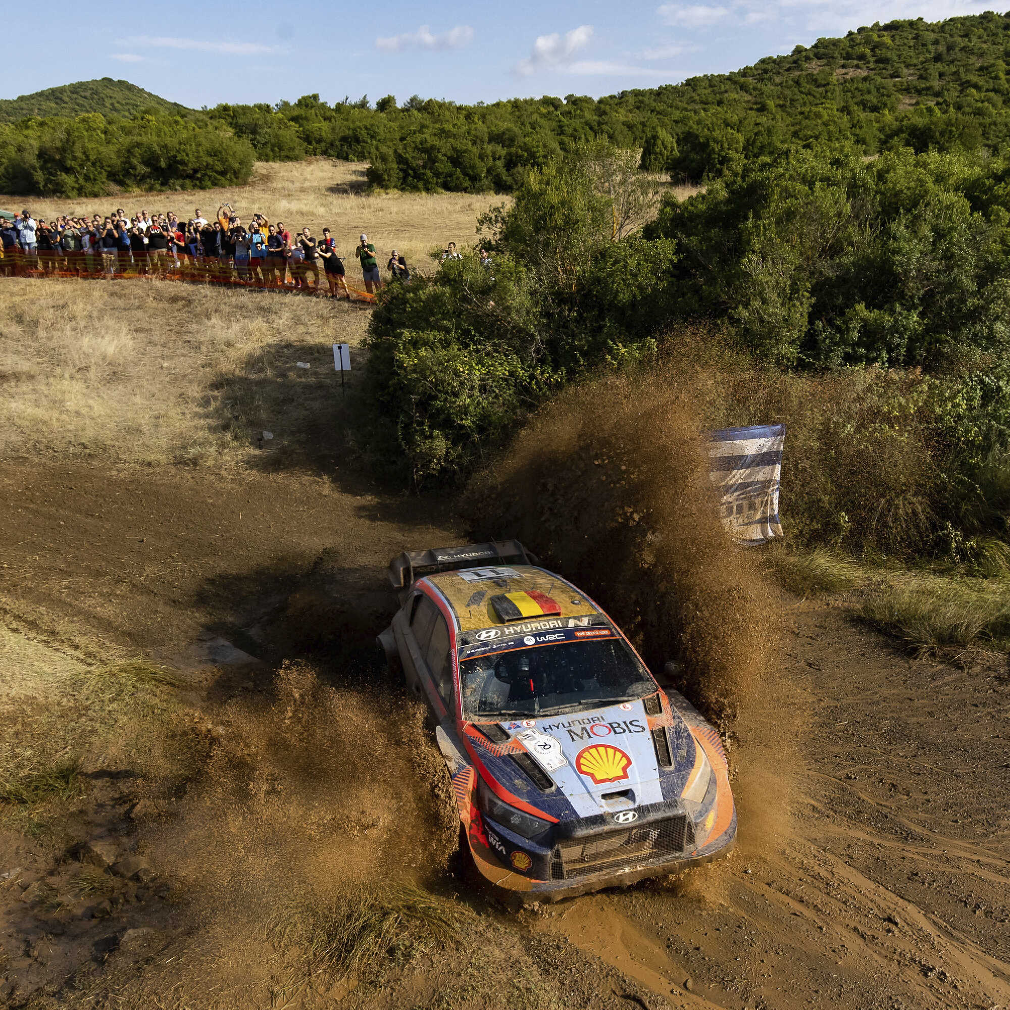 Hyundai rally car in motion on a rough road