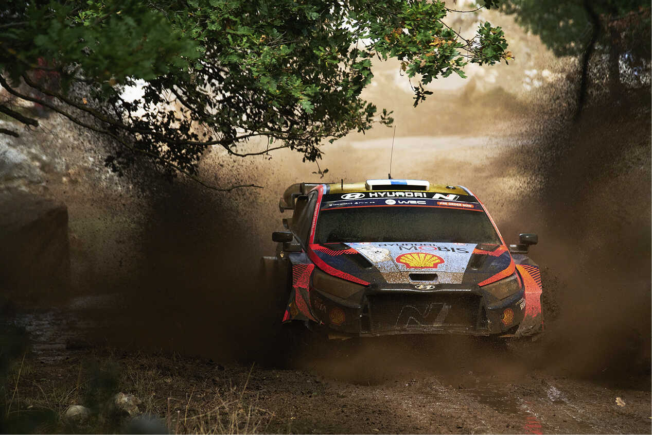 Hyundai rally car in motion on a rough road