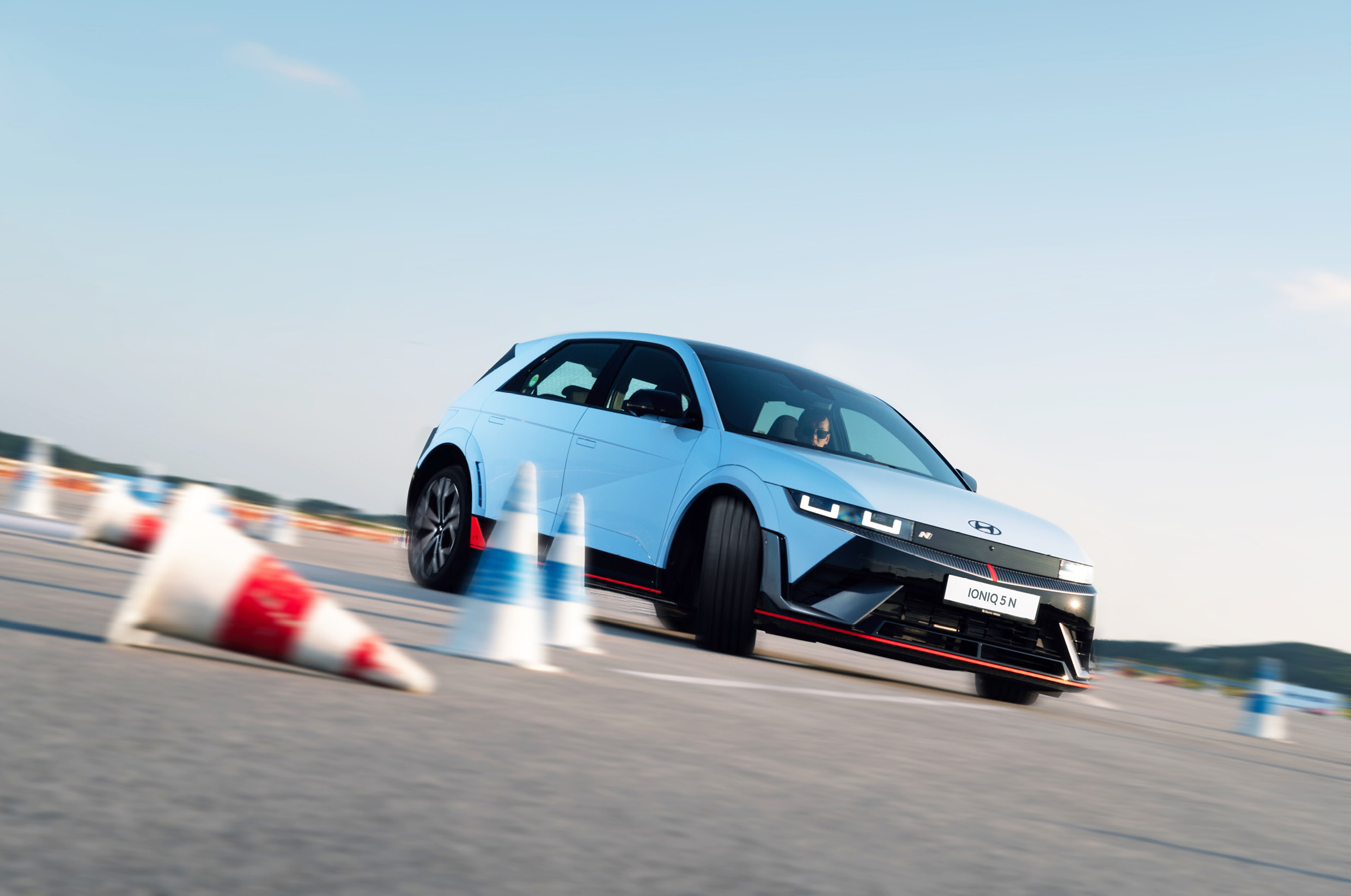 IONIQ 5 N passing between rubber cones