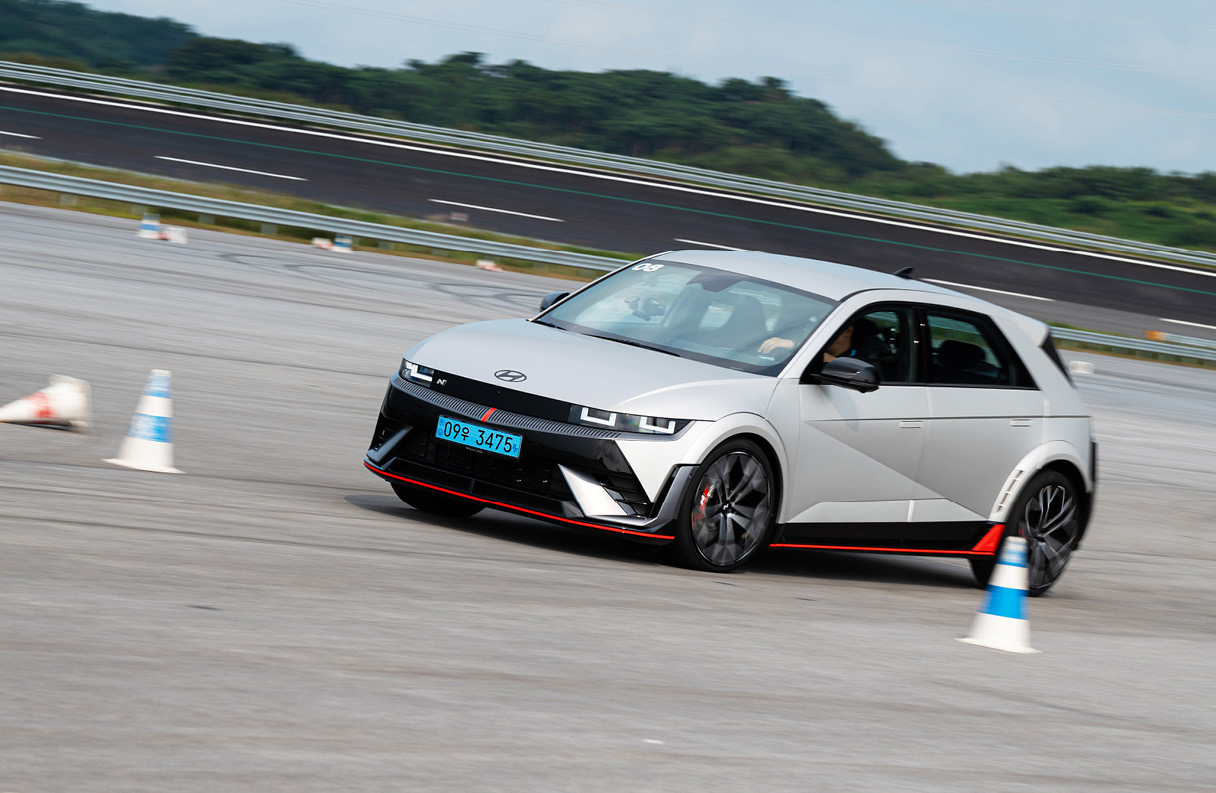 IONIQ 5 N passing between rubber cones