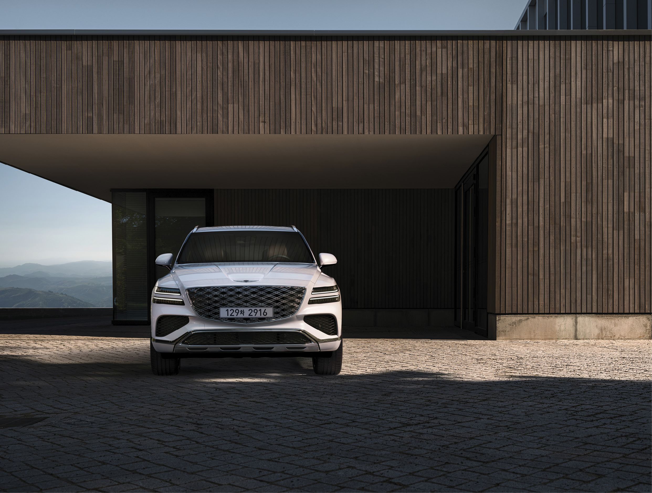 Genesis GV80 standing in front of a nice building