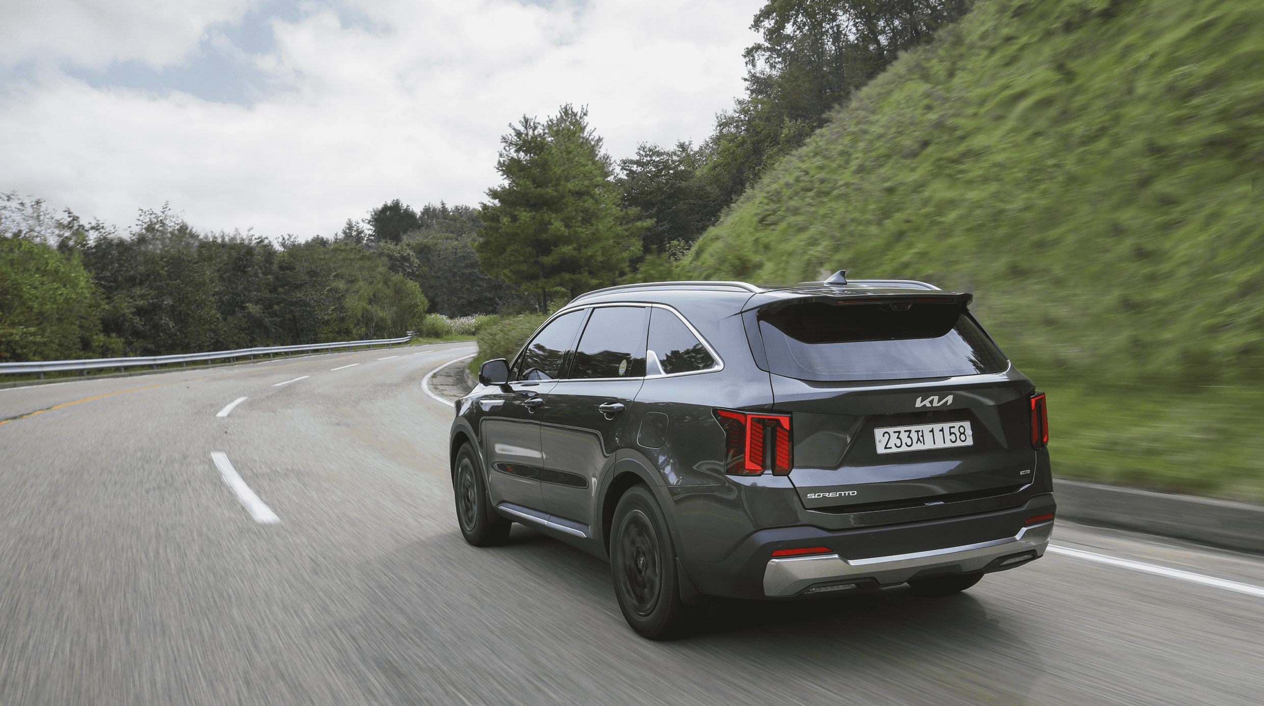 Side/rear of The New Sorento while driving
