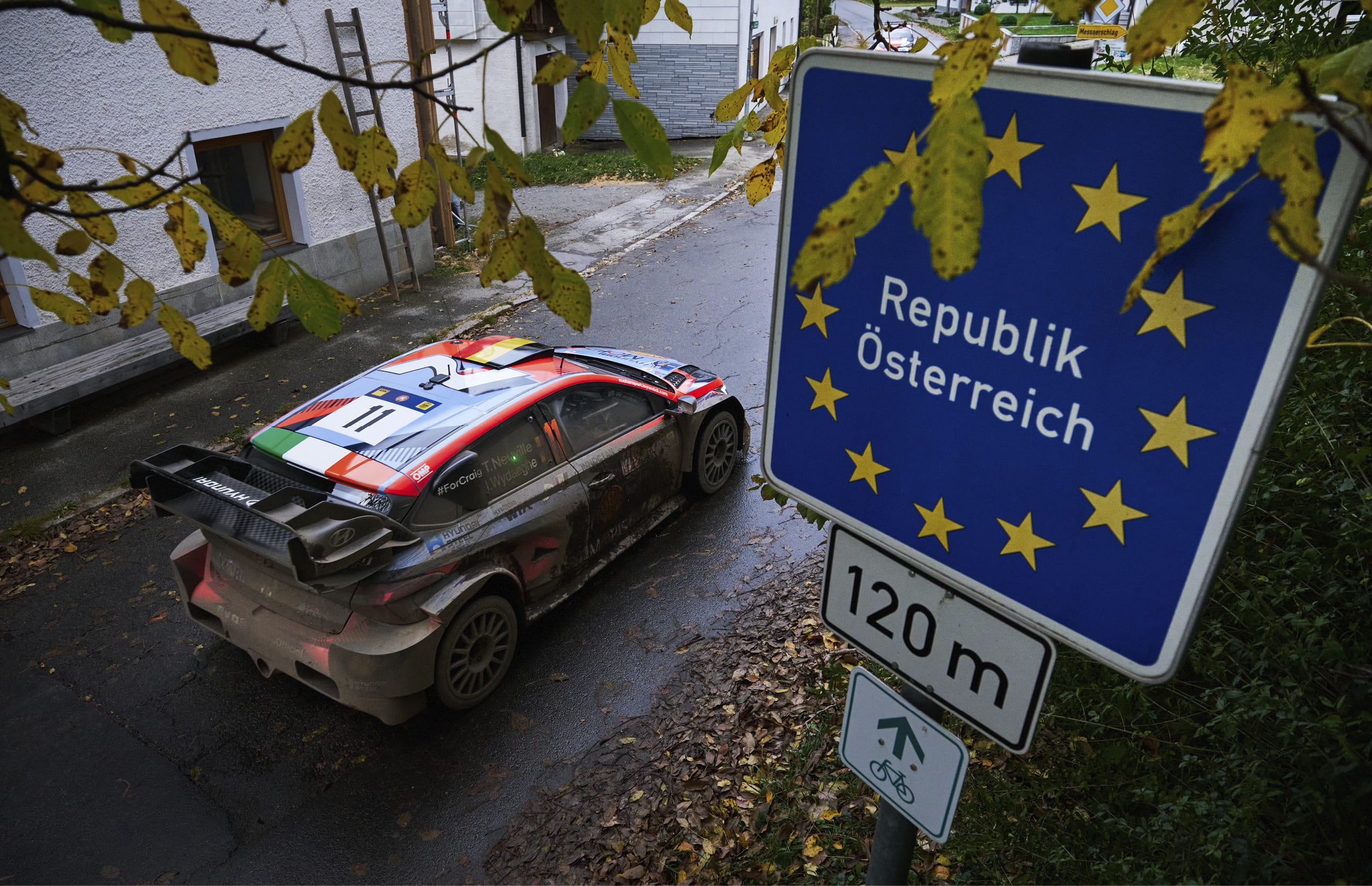 A WRC rally car is standing on the road