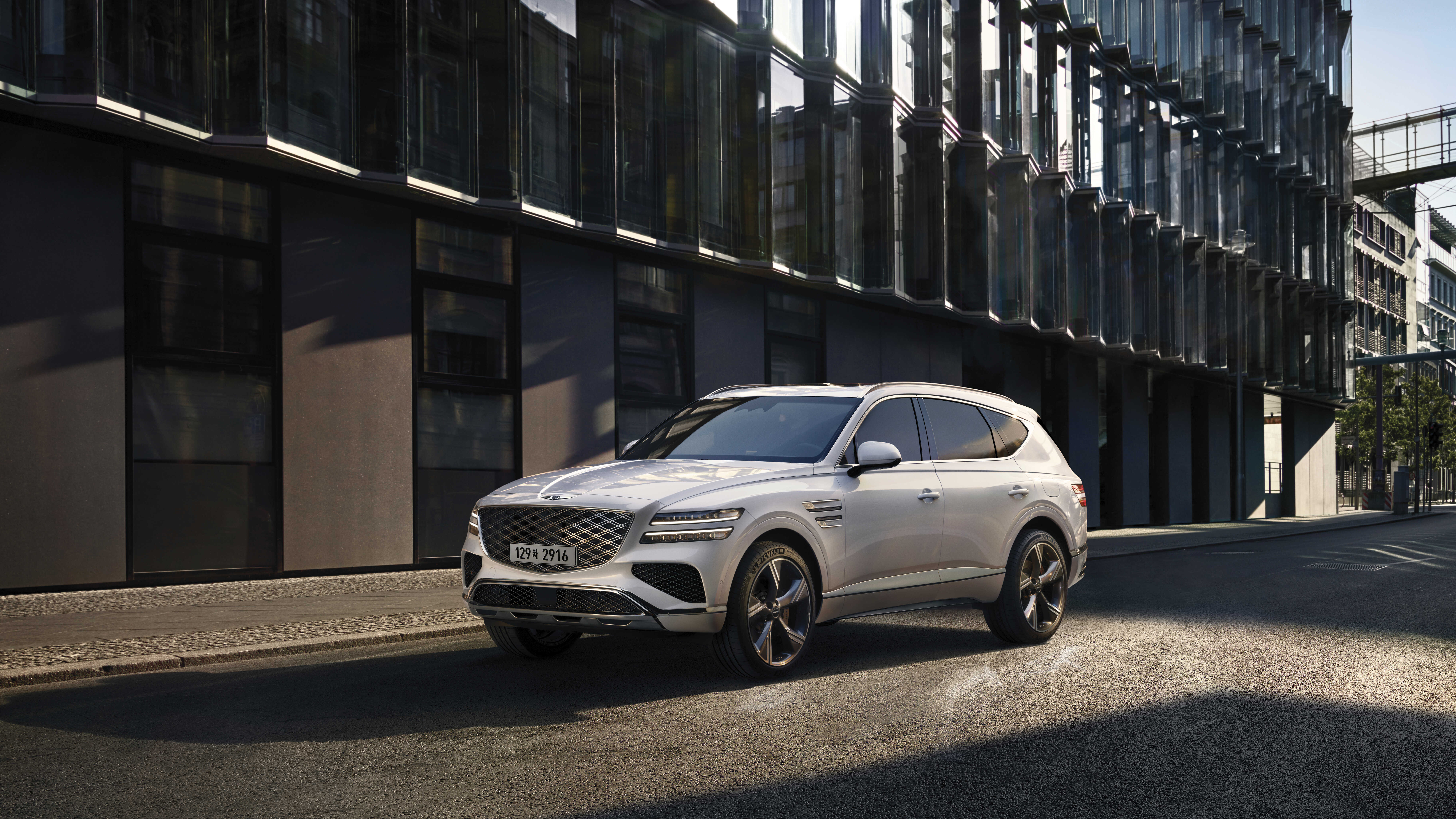 Genesis GV80 between buildings