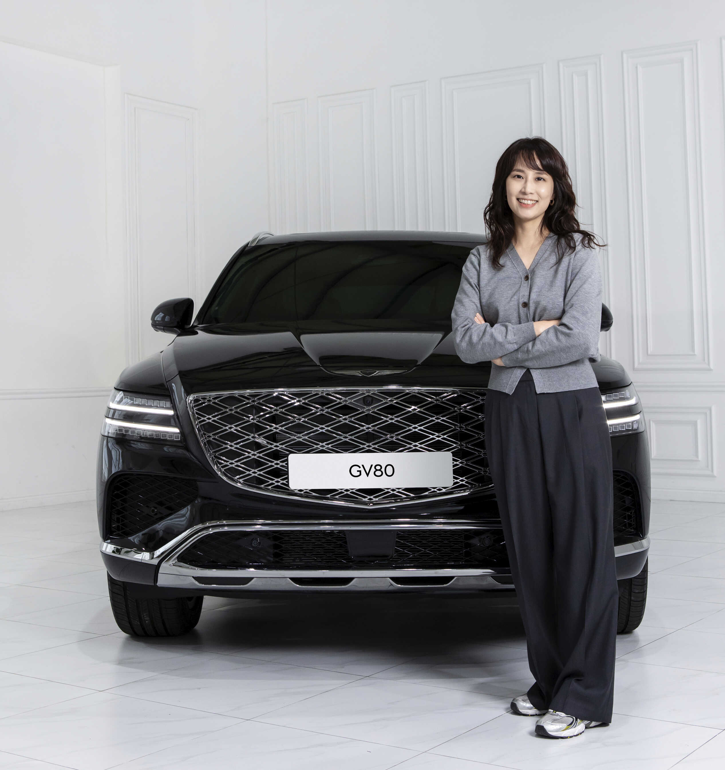 Senior researcher Minhee Yoo posing in front of the new GV80