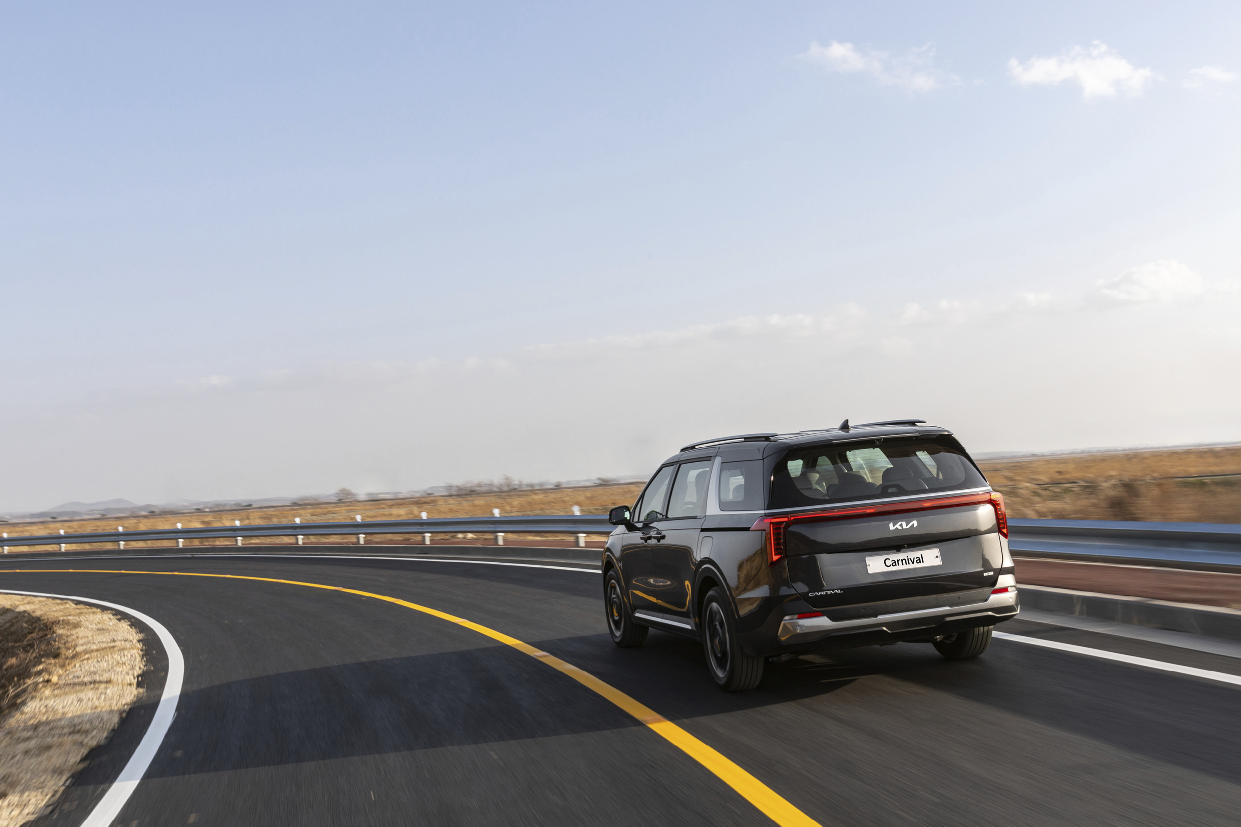 Kia the new carnival hybrid in motion