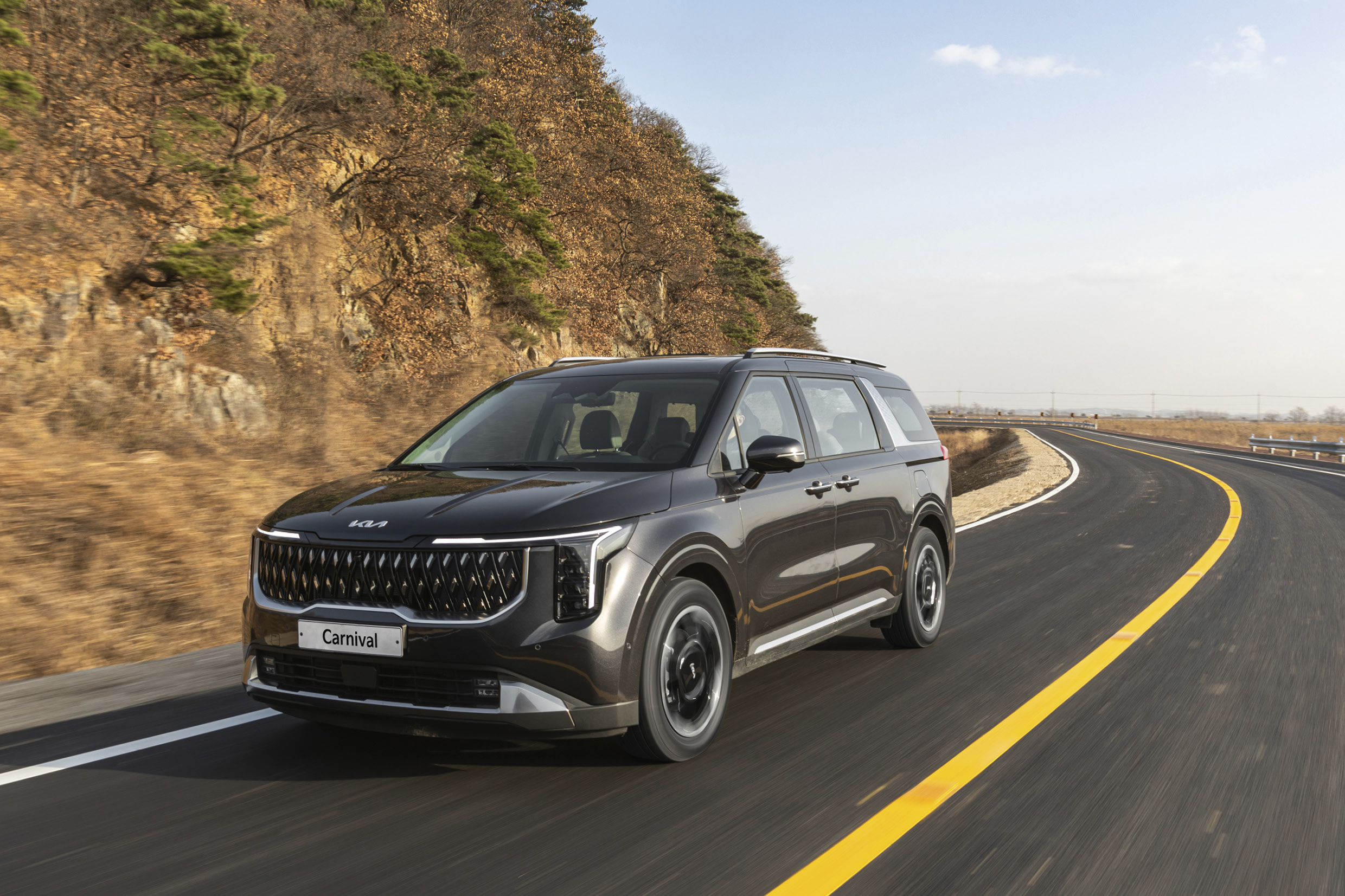 Kia the new carnival hybrid in motion