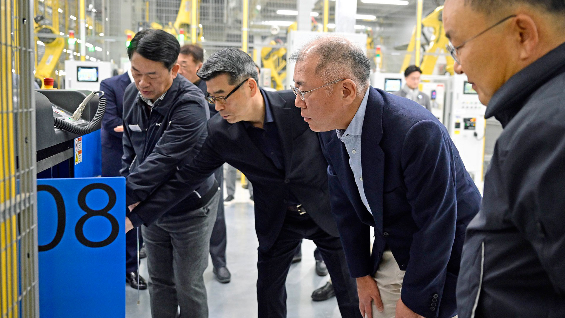 Hyundai Motor Group Executive Chair Euisun Chung looks around Kia AutoLand Gwangmyeong and encourages the employees