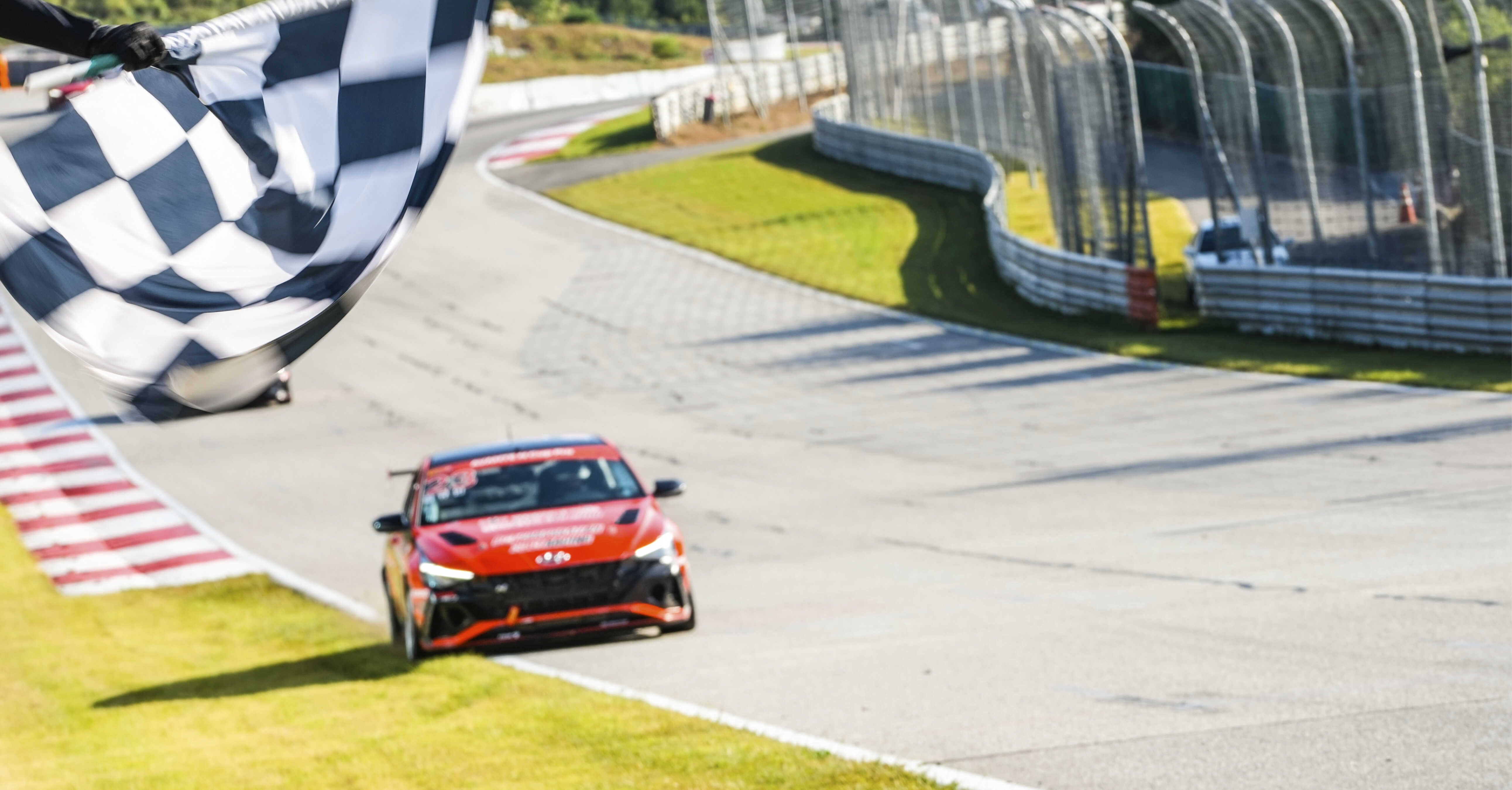 Race car passing the checkered flag