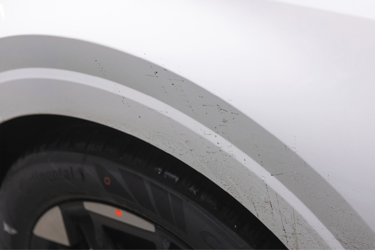 There are calcium chloride stains on the carnival's fender.