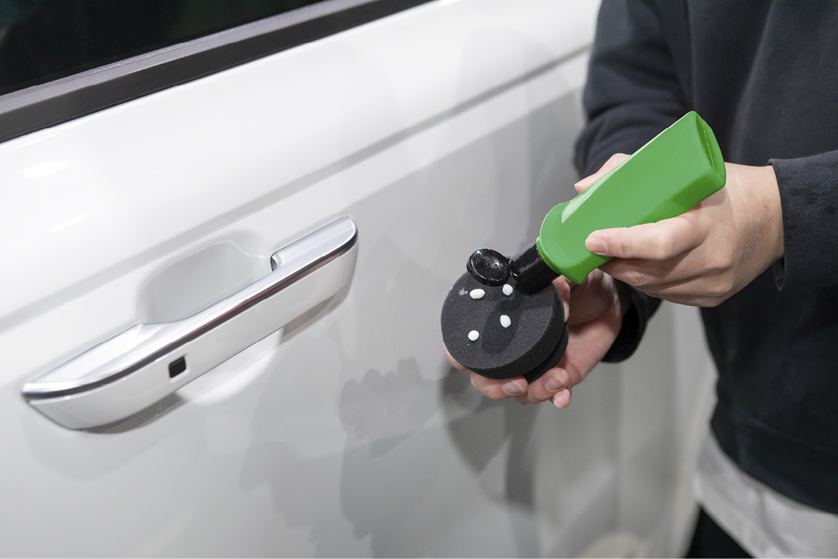 Using a paint cleanser to clean the painted surface