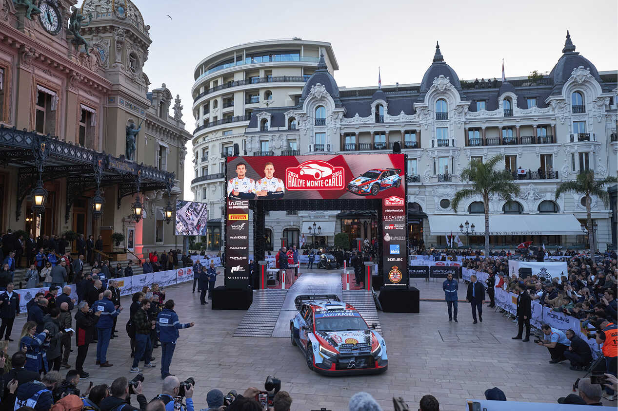 A Hyundai rally car exiting the competition set at Piazza Monte Carlo.