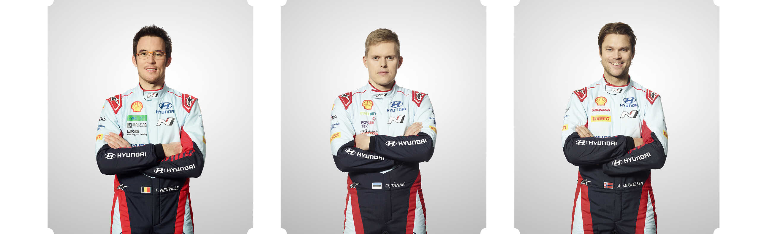 Three Hyundai drivers pose face-to-face with their arms crossed in the studio.
